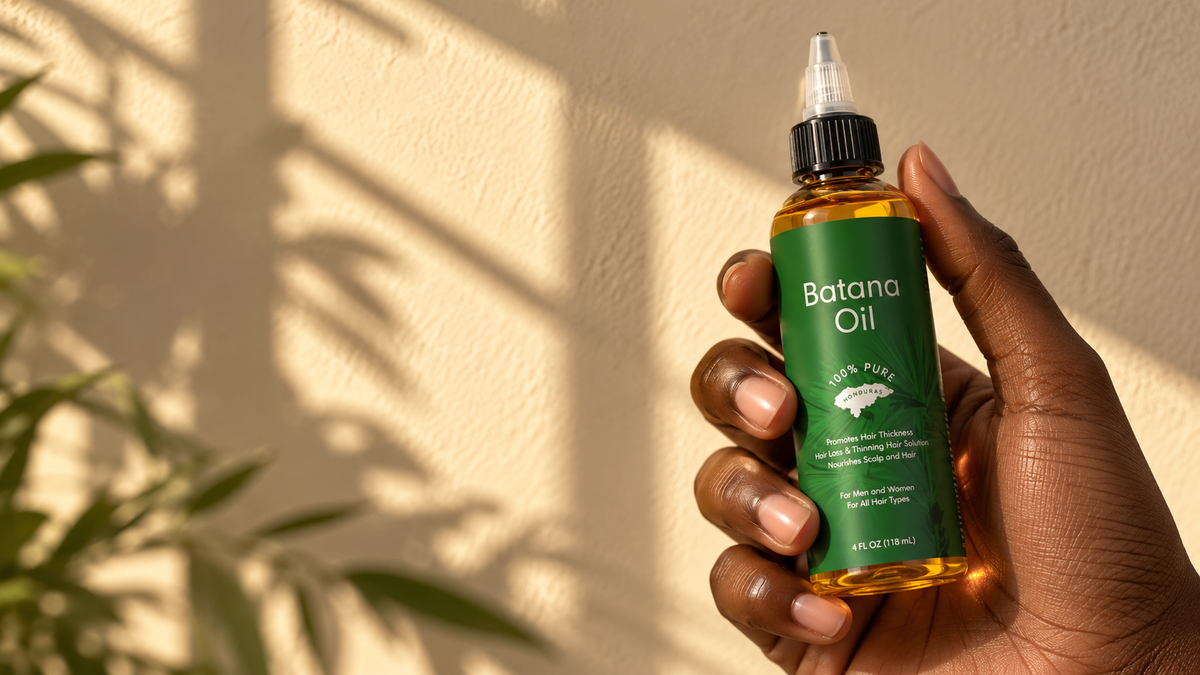 Hand holding a bottle of My Batana Oil 100% pure Batana oil, 118 mL